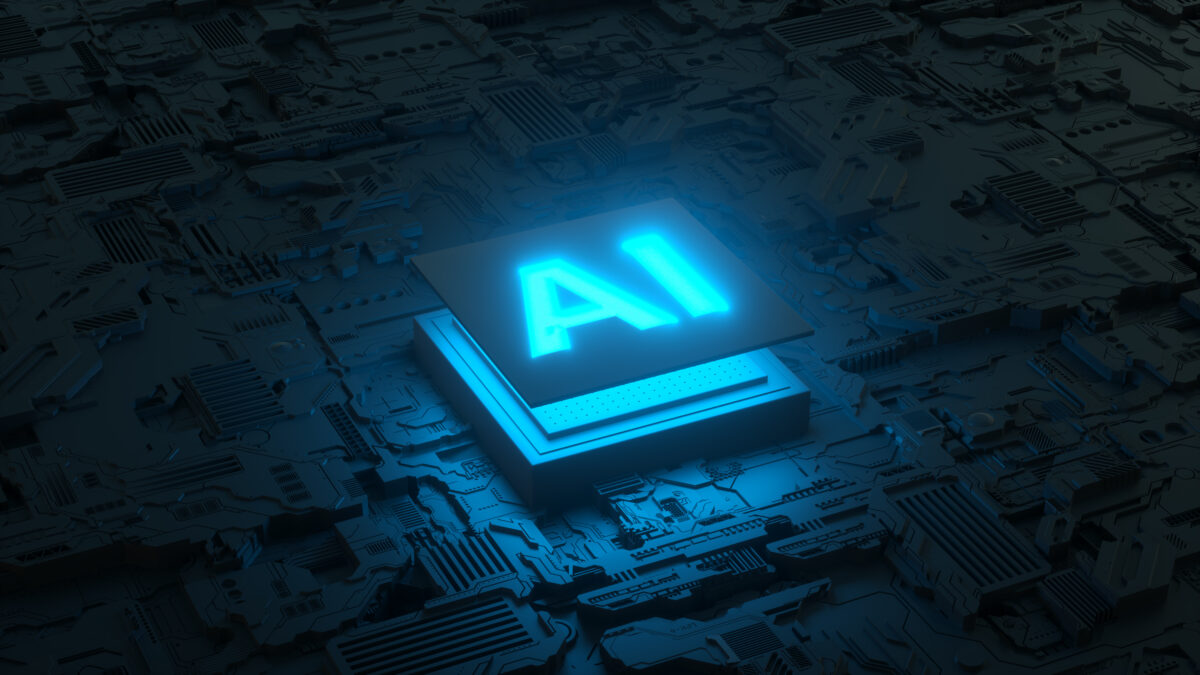 Blue glowing AI symbol atop a dense circuit-board background, representing artificial intelligence technology.