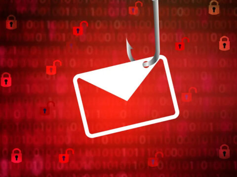 Envelope icon hanging from a hook over a red background filled with padlocks, signaling email security risk or phishing threat.