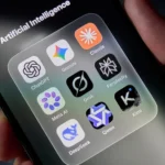 eyFHeH5jjDEbUmBZf8PrHJ-1024-80jpg - Alpha Folder labeled 'Artificial Intelligence' on a smartphone screen showing AI apps like ChatGPT, Gemini, Claude, Perplexity, Meta AI, Grok, Qwen, DeepSeek, and Kimi